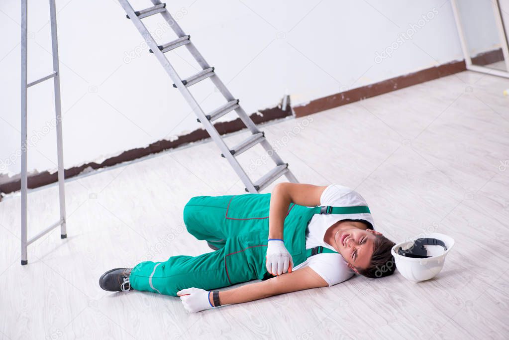 Young worker falling from the ladder 