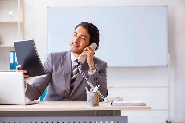 Young handsome businessman employee in the office — Stock Photo, Image