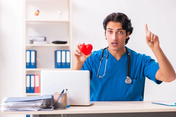 Young handsome doctor working at the clinic — Stock Photo, Image