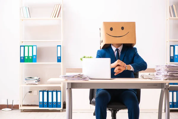 Happy man employee with box instead of his head — Stock Photo, Image