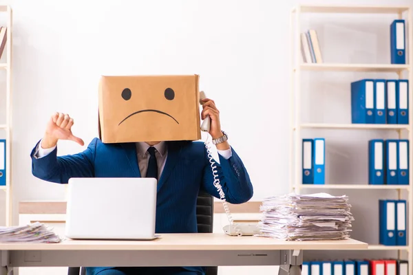 Unhappy man employee with box instead of his head — Stock Photo, Image