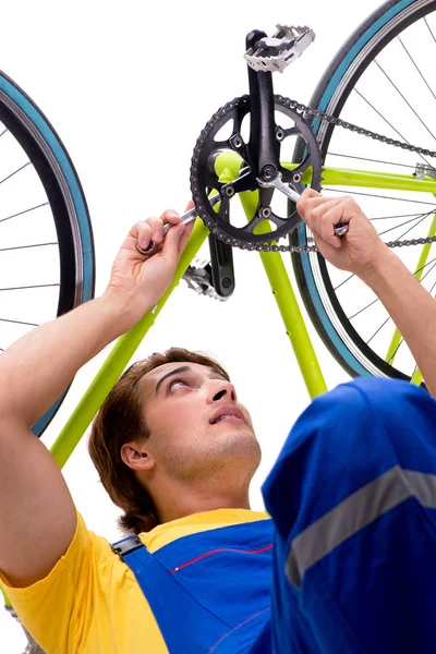 Man repairing his bike isolated on white background