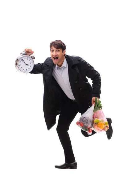 Mladý pohledný muž se zeleninou v nákupním konceptu — Stock fotografie