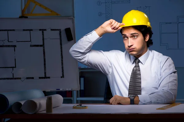 Young construction architect working on project at night — Stock Photo, Image