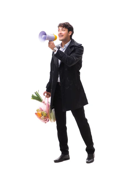 Joven hombre guapo con verduras en concepto de compras — Foto de Stock