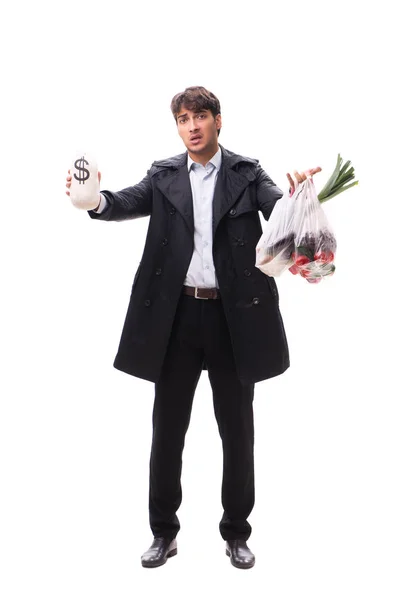 Jonge knappe man met groenten in het winkelconcept — Stockfoto