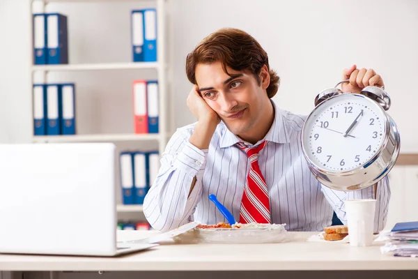 Man having meal at work during break