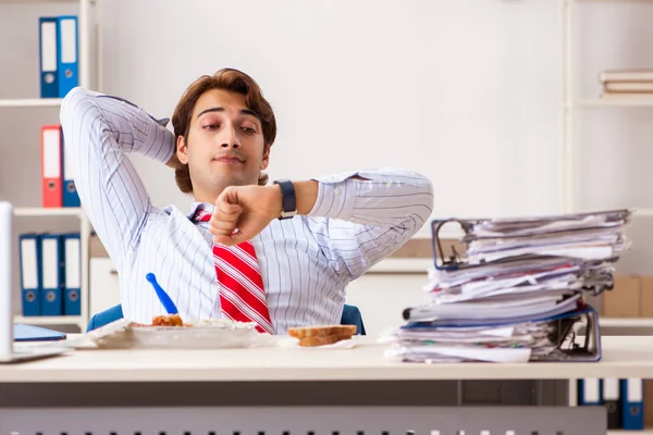 Man having meal at work during break