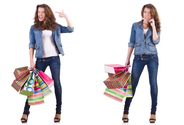 Jovem com sacos de compras isolados em branco — Fotografia de Stock