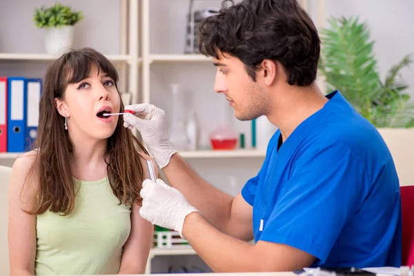 Doctor getting saliva test sample in clinic hospital — Stock Photo, Image