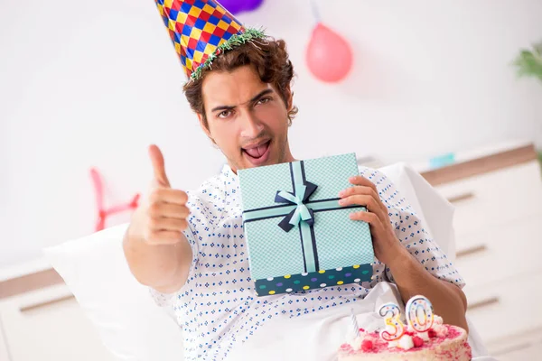 Young man celebrating his birthday in hospital — Stock Photo, Image