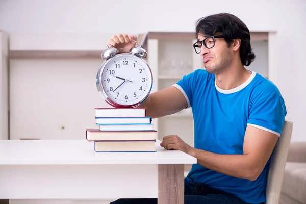 Young handsome student studying at home — Stock Photo, Image