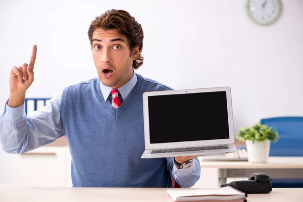 Young handsome employee working in the office — Stock Photo, Image