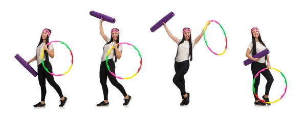 A girl in sport suit with hula hoop isolated on white — Stock Photo, Image