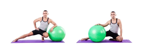 Man with swiss ball doing exercises on white — Stock Photo, Image