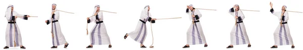 Hombre árabe tirando de la cuerda en el concepto de tira y afloja —  Fotos de Stock