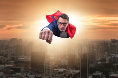 Superhero businessman flying over the city clipart