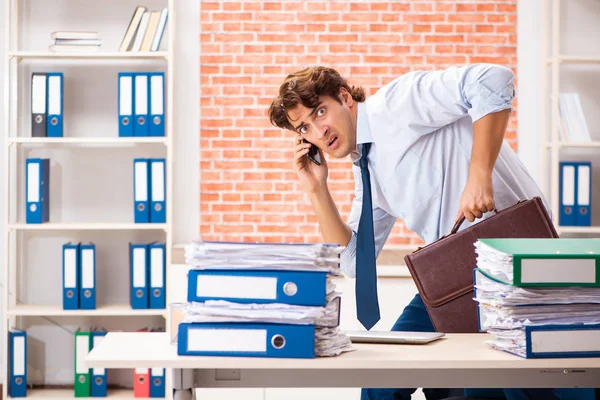 Young elegant man unhappy with too much work