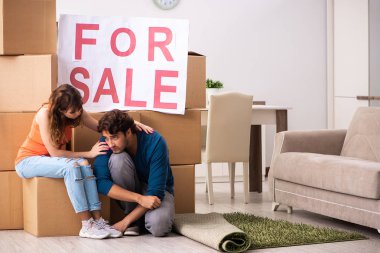 Young family offering house for sale and moving out clipart