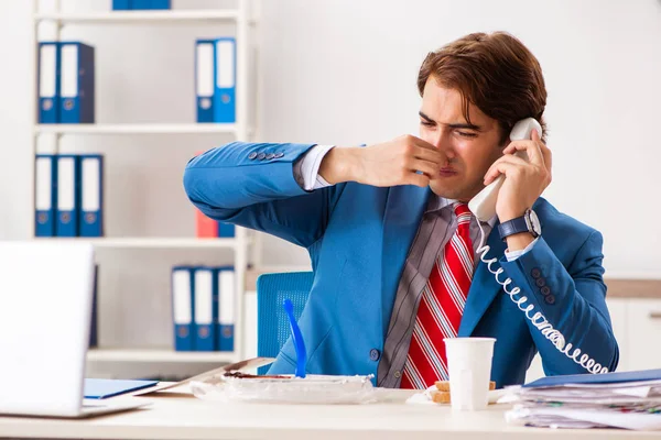 Man having meal at work during break