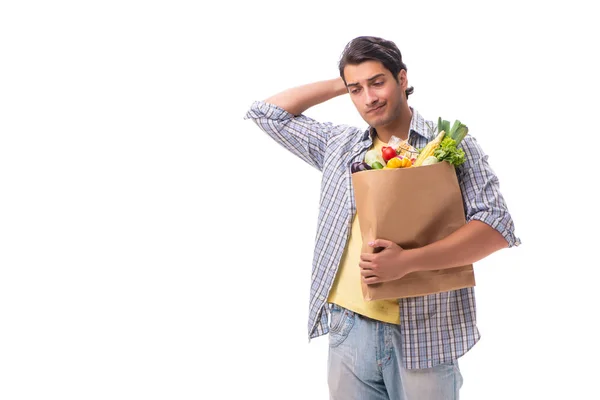 Jeune homme avec son épicerie sur blanc — Photo