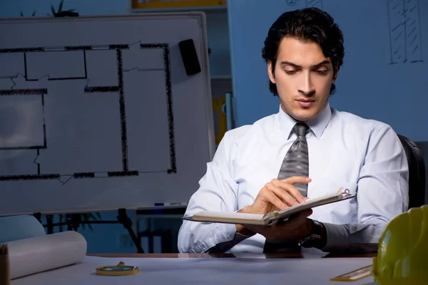 Young construction architect working on project at night — Stock Photo, Image