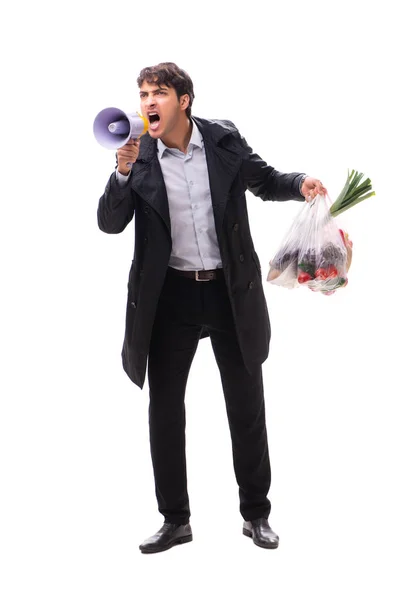 Young handsome man with vegatables in shopping concept — Stock Photo, Image