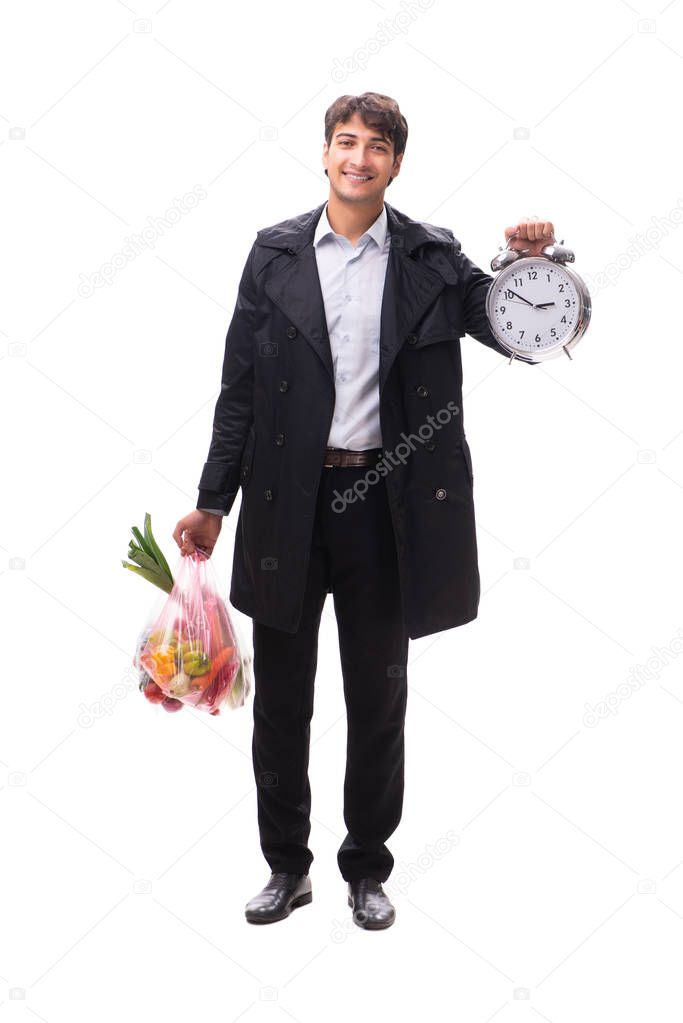 Young handsome man with vegatables in shopping concept 