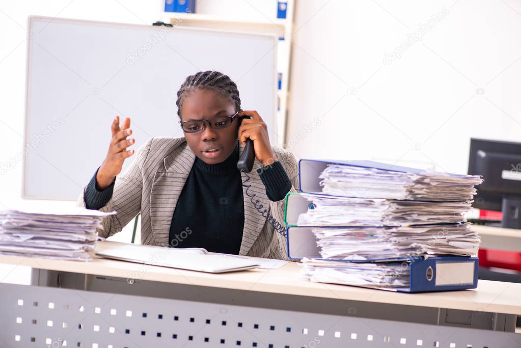 Black female employee unhappy with excessive work 