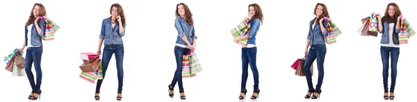 Junge Frau mit Einkaufstaschen isoliert auf weiß — Stockfoto