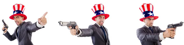 Man med amerikansk hatt och handeldvapen — Stockfoto