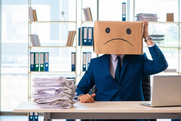 Unhappy man with box instead of his head — Stock Photo, Image