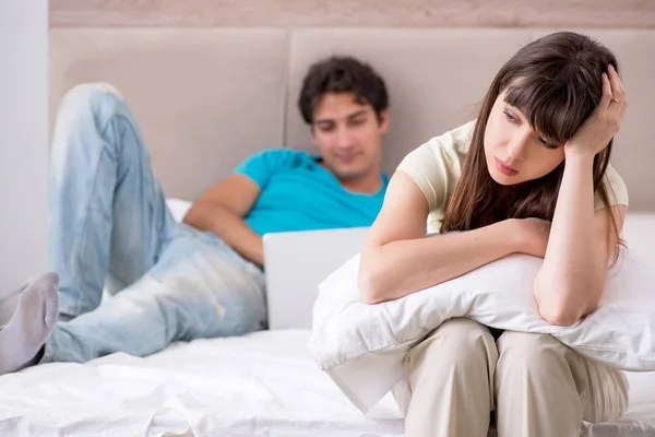 Woman feeling lonely with husband — Stock Photo, Image