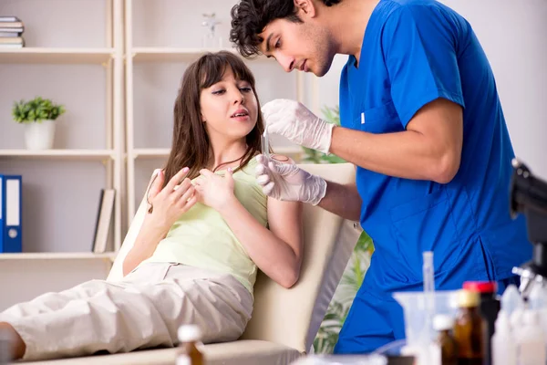 Doctor getting saliva test sample in clinic hospital