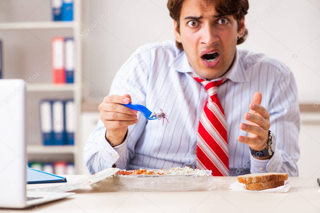 Employee eating food with cockroaches crawling around