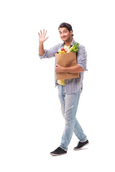 Jeune homme avec son épicerie sur blanc — Photo