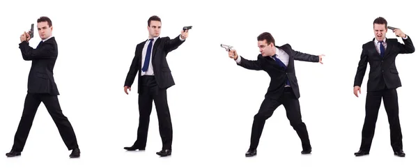 Człowiek w garniturze z pistoletu na białym tle — Zdjęcie stockowe