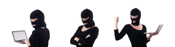 Hacker with computer wearing balaclava — Stock Photo, Image