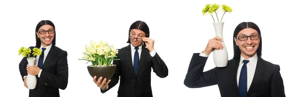 Pohledný podnikatel drží vázu s květinami, izolované na bílém — Stock fotografie