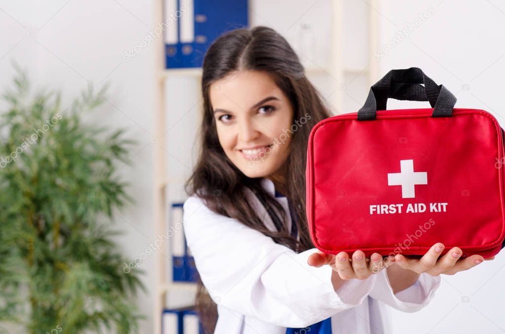 Female doctor in first aid concept