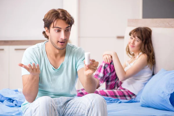 Young couple in the bedroom — Stock Photo, Image