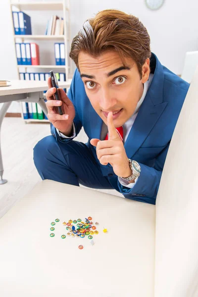 Office prank with sharp thumbtacks on chair