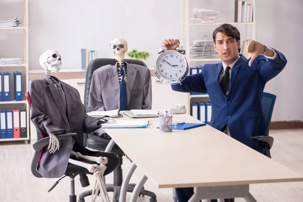 Funny business meeting with boss and skeletons