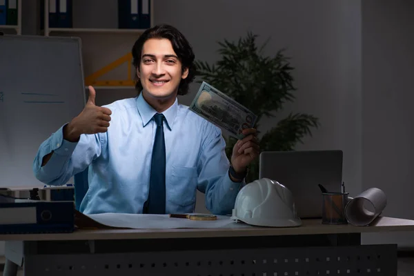 Young male architect working night at office — Stock Photo, Image