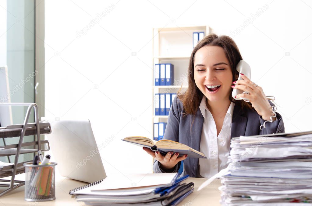 Young female employee unhappy with excessive work