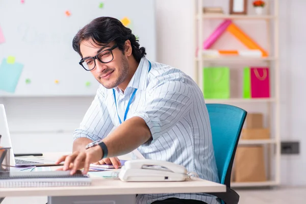 Young handsome male designer working in the office — Stock Photo, Image