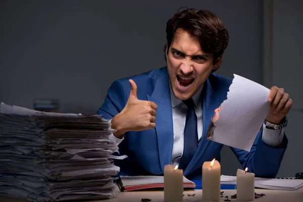 Businessman burning the evidence late in office