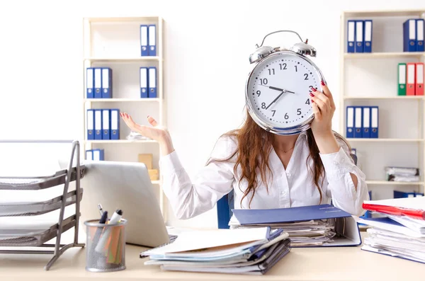 Young female employee unhappy with excessive work — Stock Photo, Image