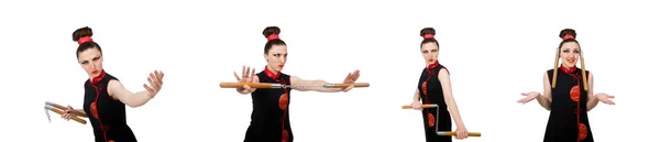 Donna divertente con nunchaku isolati su bianco — Foto Stock