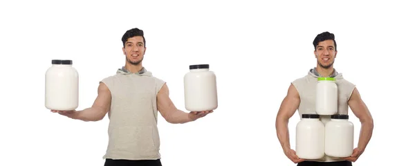 Muscular man with protein jars on white